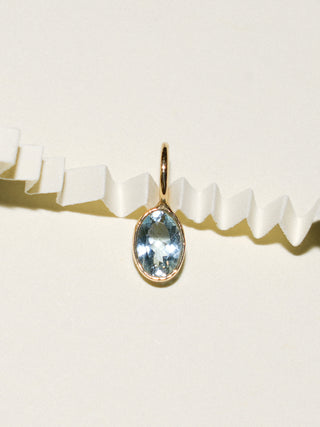 Tranquil Blue Aquamarine Oval Cut Charm in Yellow 14k Gold
