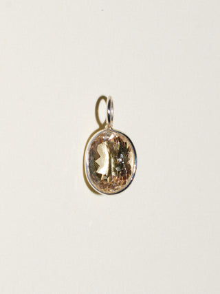 Sweet Cream Sunstone Oval Cut Charm in Sterling Silver