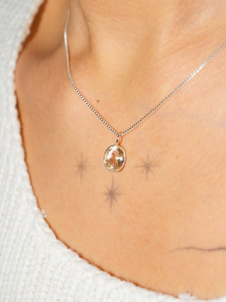 Sweet Cream Sunstone Oval Cut Charm in Sterling Silver