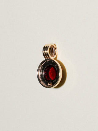 Bourdeaux Garnet Round Cabochon Triple Charm in Yellow 14k Gold