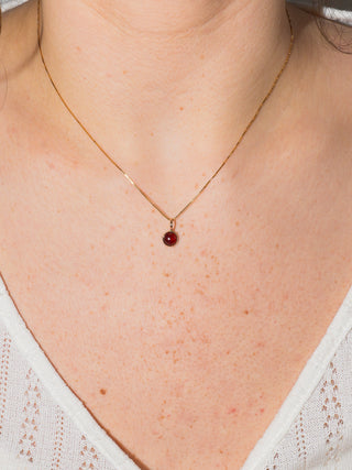 Grounding Garnet Round Cabochon Cut Charm in Yellow 14k Gold