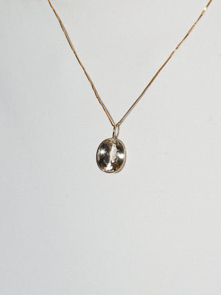 Glittering Imperial Topaz Oval Cut Charm in 14k Yellow Gold