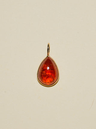 A Splash of Sun Orange Garnet Teardrop Cabochon Charm in Yellow 14k Gold