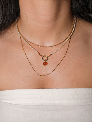 Greased Up Goddess Orange Garnet East to West Oval Cabochon Charm in Yellow 14k Gold