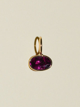Trouble Rhodolite East West Oval Cut Charm in Yellow 14k Gold