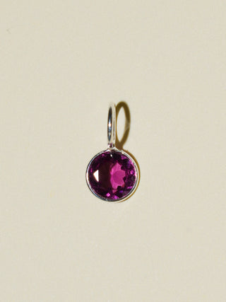 Dolly Rhodolite Round Cut Charm in Sterling Silver