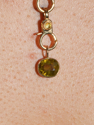 Sing your song siren Sphene East West Oval Cut Charm in Yellow 14k Gold