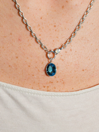 Pleased Swiss Blue Topaz Oval Cut Charm in Sterling Silver