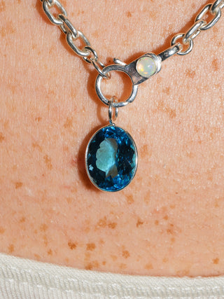 Pleased Swiss Blue Topaz Oval Cut Charm in Sterling Silver