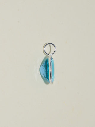 Pleased Swiss Blue Topaz Oval Cut Charm in Sterling Silver