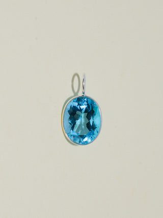 Pleased Swiss Blue Topaz Oval Cut Charm in Sterling Silver