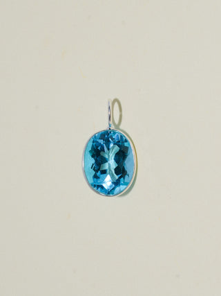 Pleased Swiss Blue Topaz Oval Cut Charm in Sterling Silver