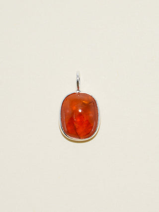 Cardamom Orange Garnet Oval Cabochon Charm in Sterling Silver
