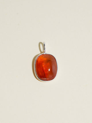Cardamom Orange Garnet Oval Cabochon Charm in Sterling Silver