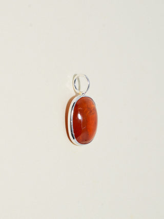 Cardamom Orange Garnet Oval Cabochon Charm in Sterling Silver