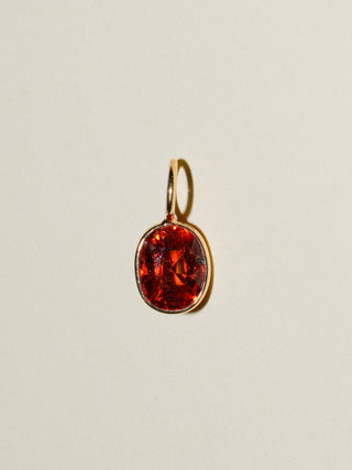 Freckled Spessartite Oval Cut Charm in Yellow 14k Gold