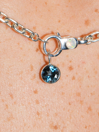 Ticket to London Blue Topaz Round Cut Charm in Sterling Silver